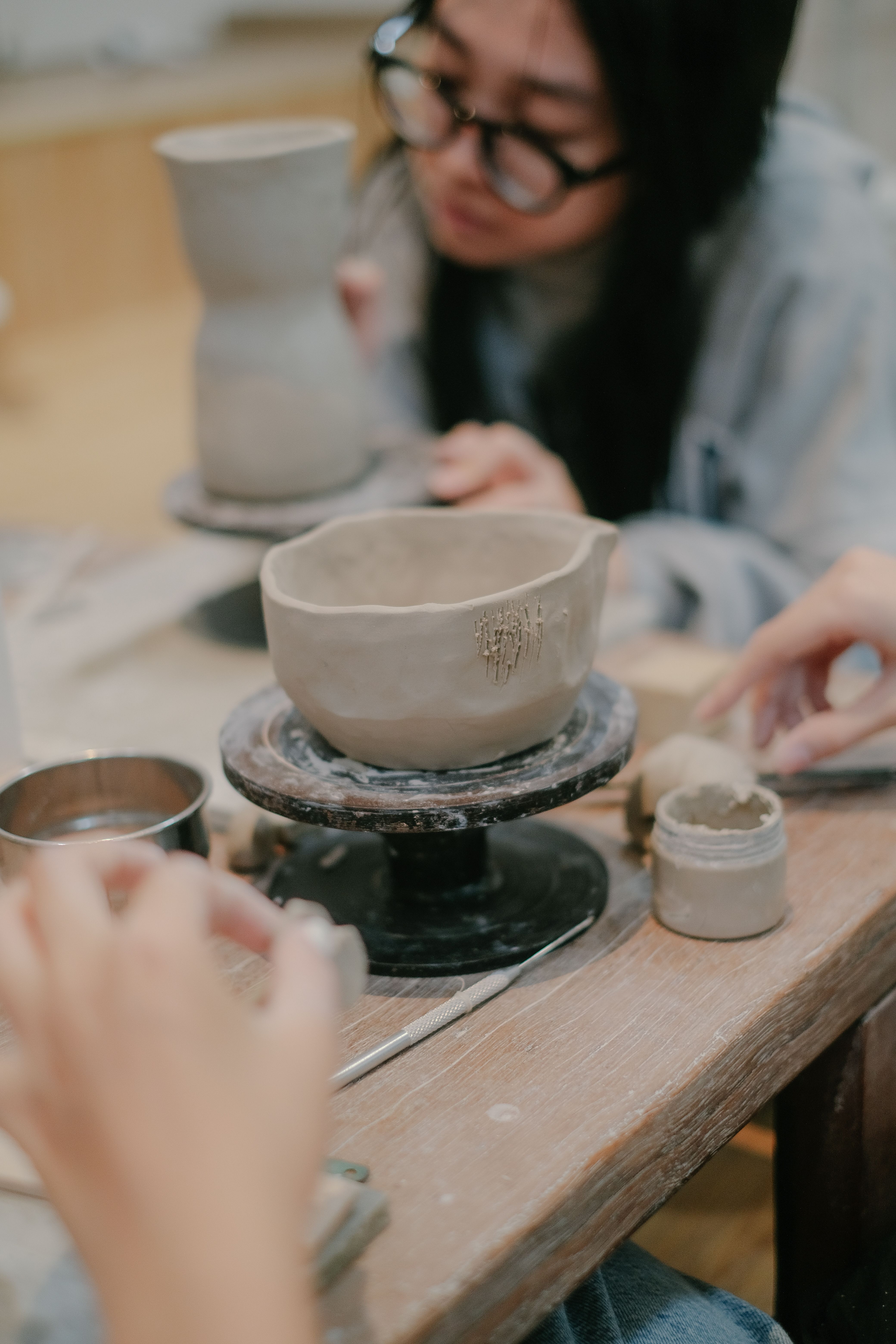 Participant making pottery in a creative workshop